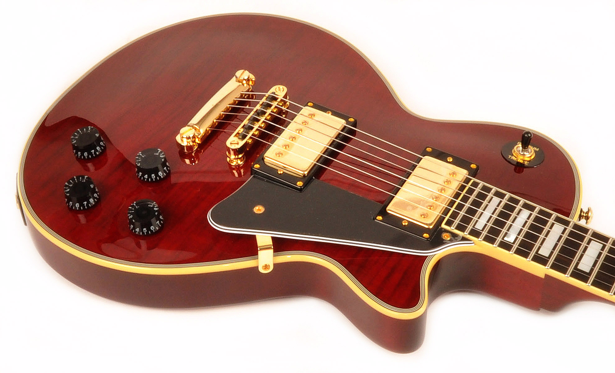 red and gold electric guitar